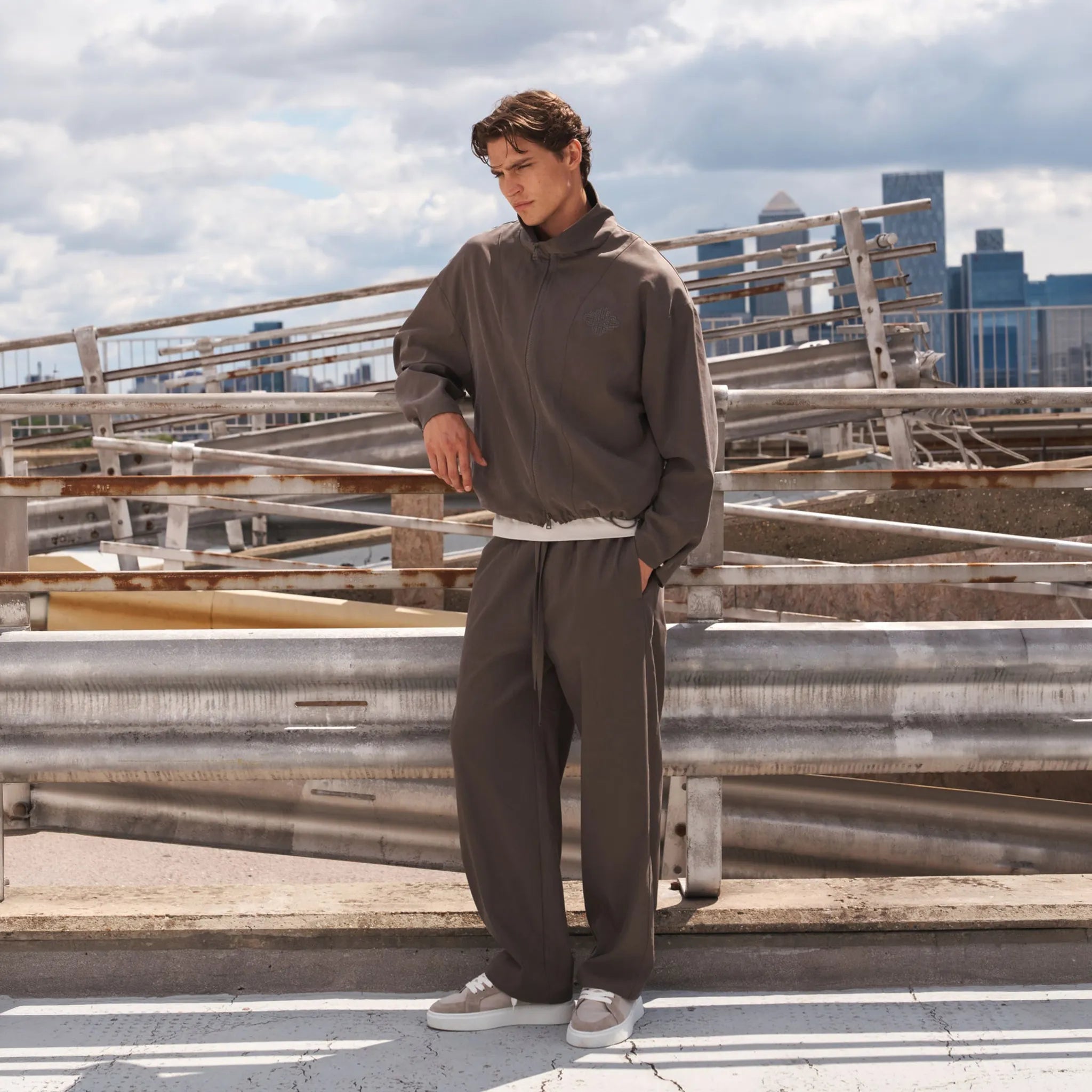 Front Side View of The Couture Cupro Panelled Brown Trousers